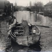 A row boat negotiates Main Road Harwich