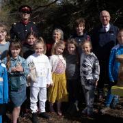 Buzzing - Children of Wix and Wrabness Primary School with Nigel Spencer, Deputy Lord Lieutenant of Essex, station adopter Julia Prigg and Luke Dixon of the Bee Friendly Trust. Picture: Bee Friendly Trust