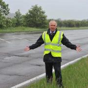 Repairs - Councillor Ivan Henderson next to the A120