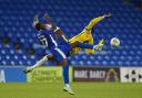 Colchester United's Samson Tovide clashes with Cardiff City's Jamilu Collins and is shown the red card during the Carabao Cup. Image: PA