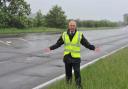 Repairs - Councillor Ivan Henderson next to the A120