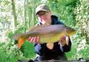 TOP CATCH: Ashley Haveron with his 9lbs 6ozs common carp, caught from Bradfield Lake.