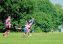 TRY-SAVING TACKLE: Mistley Rugby Club’s Connor Williams takes evasive action in Sunday’s memorial match for stalwart Chris Cooper. Colchester provided the opposition at Furze Hill.