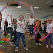 Children taking part in circus skills event