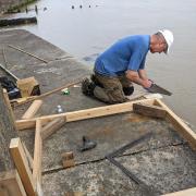 Marcus Vergette works on measurements for the Time and Tide bell in Harwich