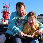 Family - Matthew and Lilly Watson reading at Harwich Pier