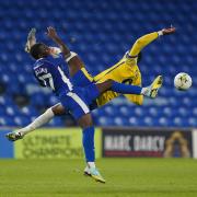 Colchester United's Samson Tovide clashes with Cardiff City's Jamilu Collins and is shown the red card during the Carabao Cup. Image: PA