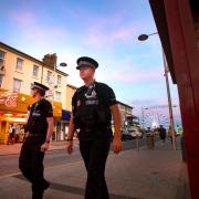 Clash - police officers on patrol outside Gaiety Amusements in Clacton