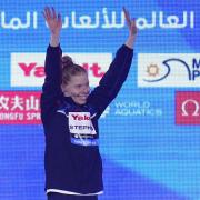 Golden girl - Laura Stephens celebrates on the podium after winning Women's 200m Butterfly gold at the World Championships in Doha
