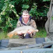 SPECIAL CATCH: Richard Harfield with his first common carp – a 12lbs 2ozs catch from Bradfield Lake.