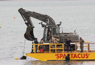 the remains of a ww2 V2 rocket is recovered from Harwich harbour on Saturday
the first pull gets it to the surface
