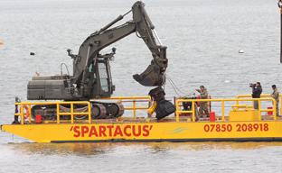the remains of a ww2 V2 rocket is recovered from Harwich harbour on Saturday
The V 2 lands on the barge
