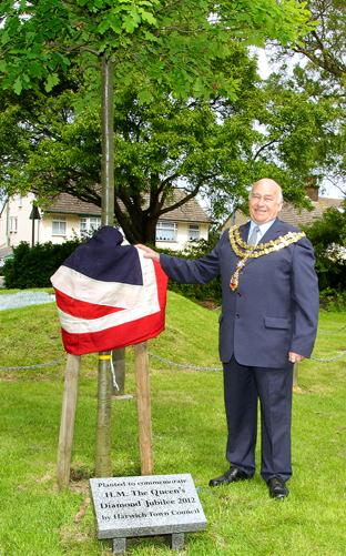 **PHOTO BY MARIA FOWLER**
Harwich Mayor Cllr John Thurlow officially unveiled the oak tree planted in the mayors garden for the diamond jubilee.
