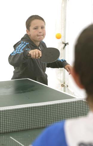 steve brading
14-07-12
The Tendring Show in Manningtree.
Morgan Harvey, 10, who plays in the Clacton Table Tennis league, playing at their table at the show