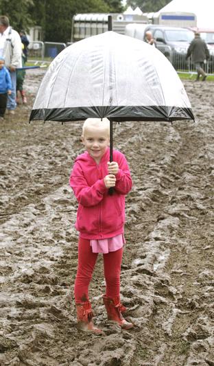 steve brading
14-07-12
The Tendring Show in Manningtree.
Ava-Violet Lovesee, 4, dressed for the weather and the mud
