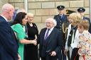 President of Ireland Michael D Higgins (centre) during a wreath-laying ceremony at the Memorial to the victims of the Dublin and Monaghan bombings (Oliver McVeigh/PA)