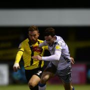 In motion - Colchester United defender Ryan Clampin (right) in action against George Thomson of Harrogate Town, last season PIcture: RICHARD BLAXALL