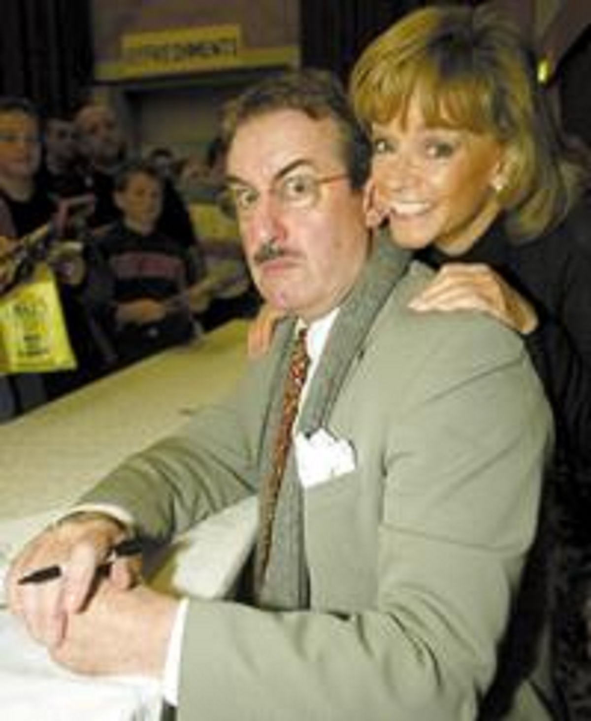 Smile Marlene - John Challis and Sue Holderness take a break from signing autographs