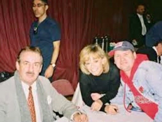 Smile please - an Only Fools fan poses with John Challis and Sue Holderness