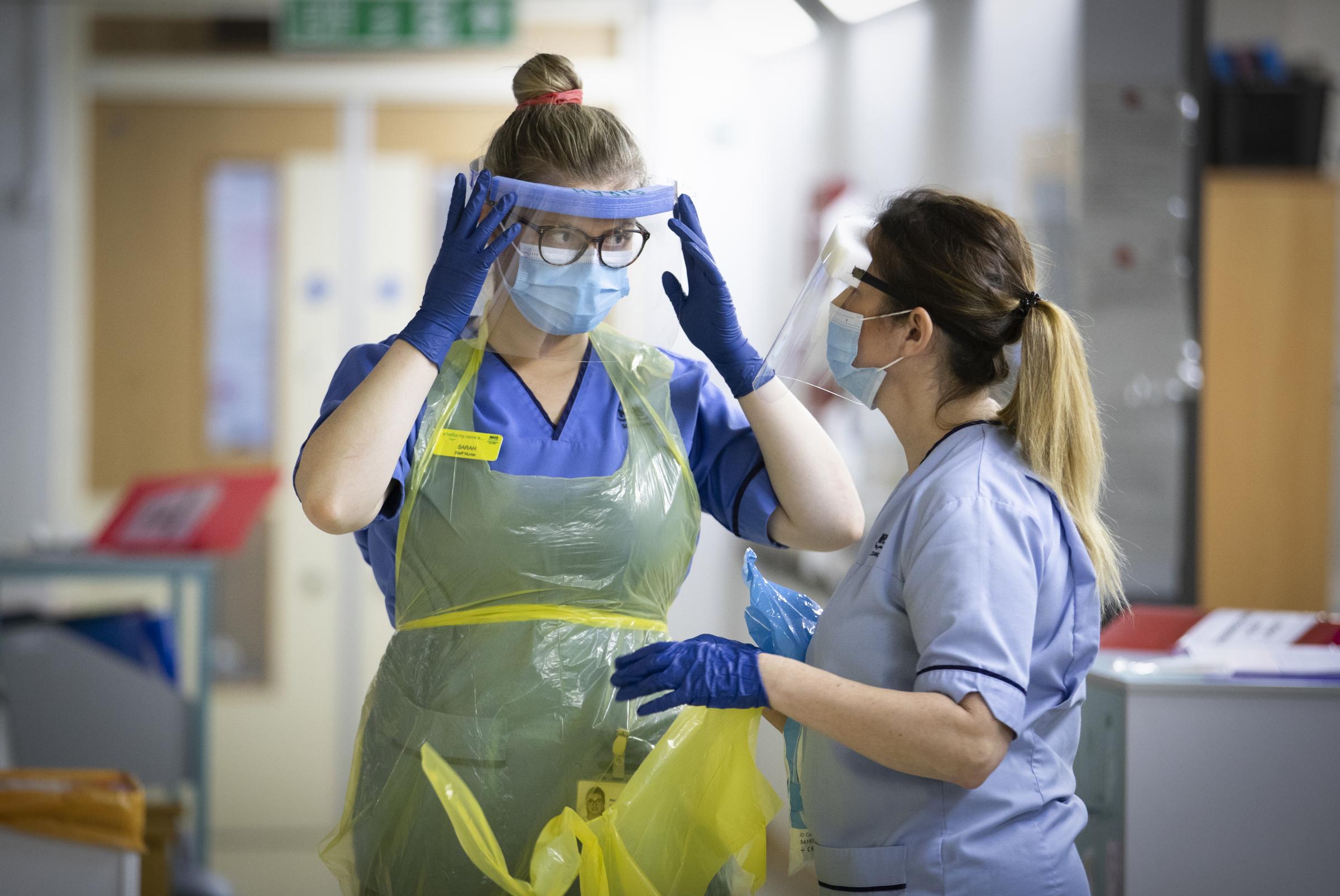 Nurses changing their PPE on Ward 5, a Covid Red Ward, at the Royal Alexandra Hospital in Paisley. Picture date: Wednesday January 27, 2021..