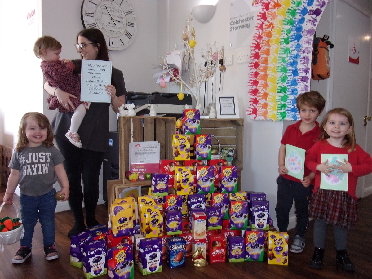 Reality choc - youngsters take stock of the delicious chocolate donated by parents. Marcie-Mae Etheridge is being held by Ashley Marsh, along with (from left) Meaghan Price, Leo Boot and Sophie Kelly