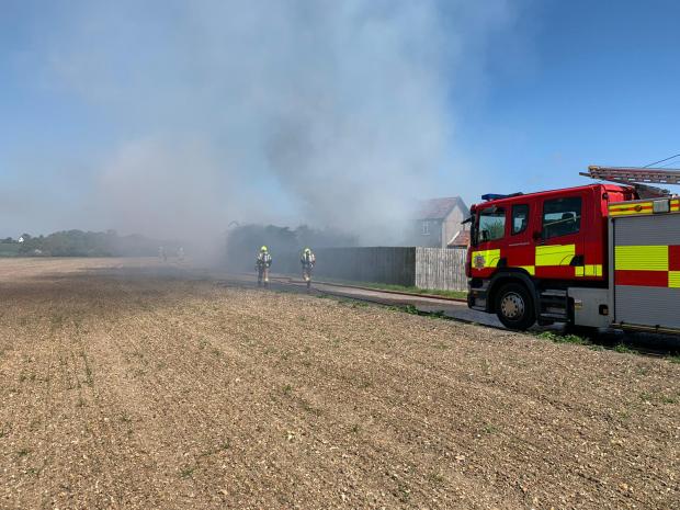 Harwich and Manningtree Standard: Firefighters tackle the fire in Boreham