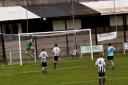 Leap: Harwich and Parkeston goalkeeper Brad Cook could do little to prevent Holbeach's strike.