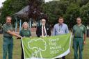 Winners - Tendring councillor Michael Talbot open spaces staff and volunteers with the 2022 Green Flag at Cliff Park, Dovercourt.