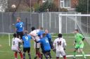 High rise: Little Oakley compete for a header during their 3-1 win over Clapton.
