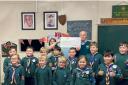 Donation - Melvyn Boley vets Captain of Harwich and Dovercourt Golf club presenting the cheque for £1515.00 to Vikki Howard cubs leader of Oakleys and Ramsey Cub Group