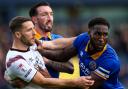 Shrewsbury Town's Chey Dunkley is suspended for the FA Cup tie with Colchester.