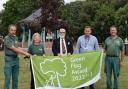Winners - Tendring councillor Michael Talbot open spaces staff and volunteers with the 2022 Green Flag at Cliff Park, Dovercourt.