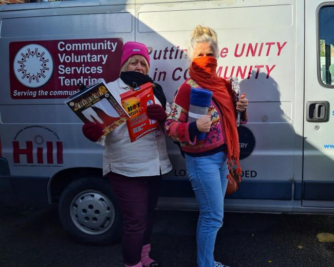 Keep warm - CVST's Jan Kealy and Nicola Vella with items from the winter warmth packs