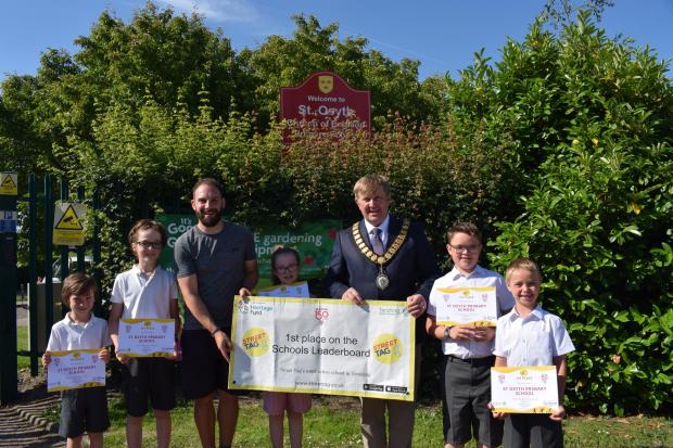 Winners - Peter Harris, Tendring Council chairman  presenting a banner to St Osyth C of E Primary School pupils. Picture: Will Lodge/TDC