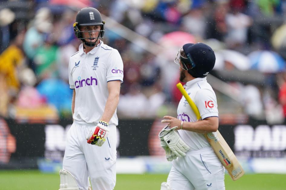 England lose both openers between rain showers as Australia seize the initiative