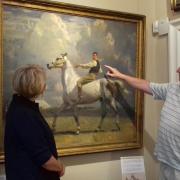 ART ATTACK: John Osborne with Sir Alfred Munnings’ painting The Grey Horse at the Munnings Museum. The painting depicts Mr Osborne’s grandfather, Ned