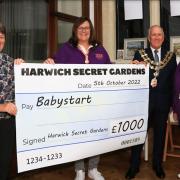 Cheque presentation: Sue Daish, from Harwich Secret Gardens, Wendy Taylor-Jones from Home-Start Harwich, mayor Ivan Henderson and Home-Start's Frances Jones, at Harwich Secret Gardens’ presentation evening at Old Bank Studios. Picture: Maria Fowler