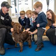 Adorable - PC Ross Ashcroft with Dexter and pupils.