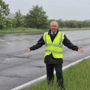 Road works: Harwich mayor Ivan Henderson pictured next to the A120