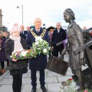 Commemoration - then-Harwich mayor councillor Ivan Henderson and Amelia Steele, pupil at Spring Meadows Primary School at Harwich's Holocaust Memorial Day in January