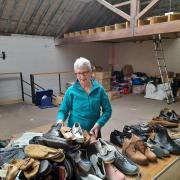 Shoes - Stella Tyrrell sorts a shoe delivery