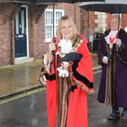 Procession - new Harwich Mayor Pam Morrison braves the rain while on her way from Guildhall to St Nicholas' Church