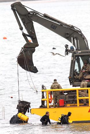 the remains of a ww2 V2 rocket is recovered from Harwich harbour on Saturday
