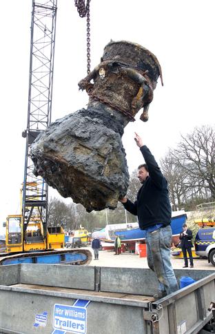 the remains of a ww2 V2 rocket is recovered from Harwich harbour on Saturday
Colin Rose, from Harwich and Dovercourt sailing Club with the recovered V2 at Mistley Quay