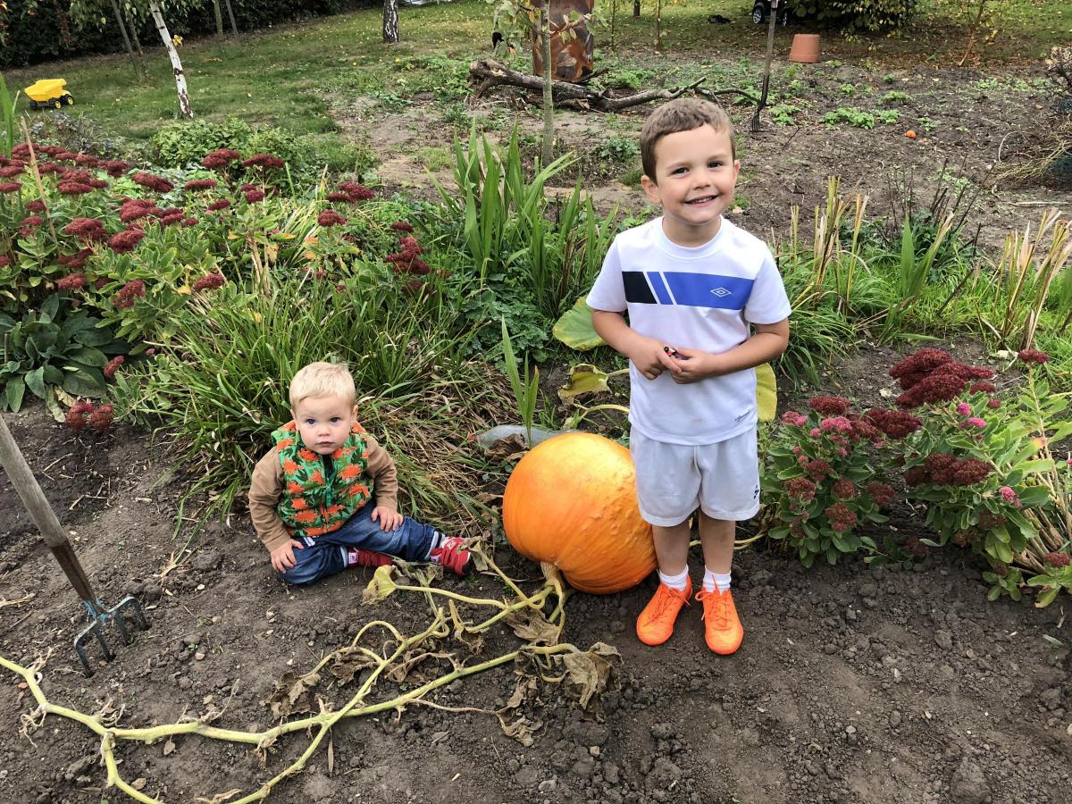 Growing - Youngsters with their home grown pumpkins